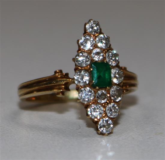 A gold, emerald and diamond cluster marquise shaped ring, size K.